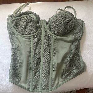 Green corsette going out top